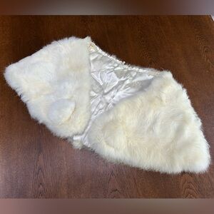 White Rabbit Fur Cape. Lined, silklike acetate fabric. Pompoms. Hook/eye closure